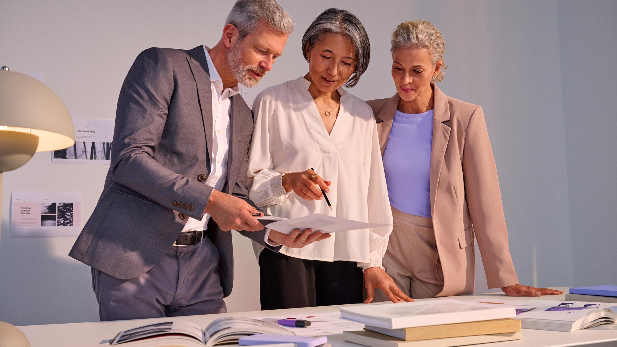 Group in a business meeting, actively participating while using hearing aids.