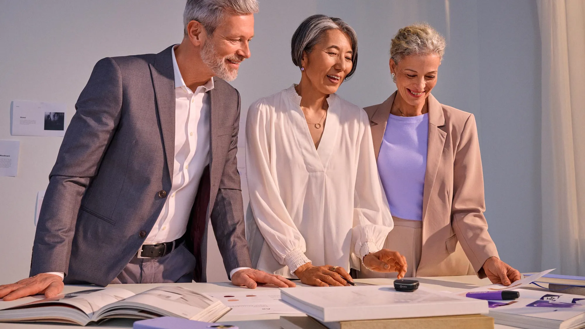 Team in a business meeting planning while wearing hearing aids.