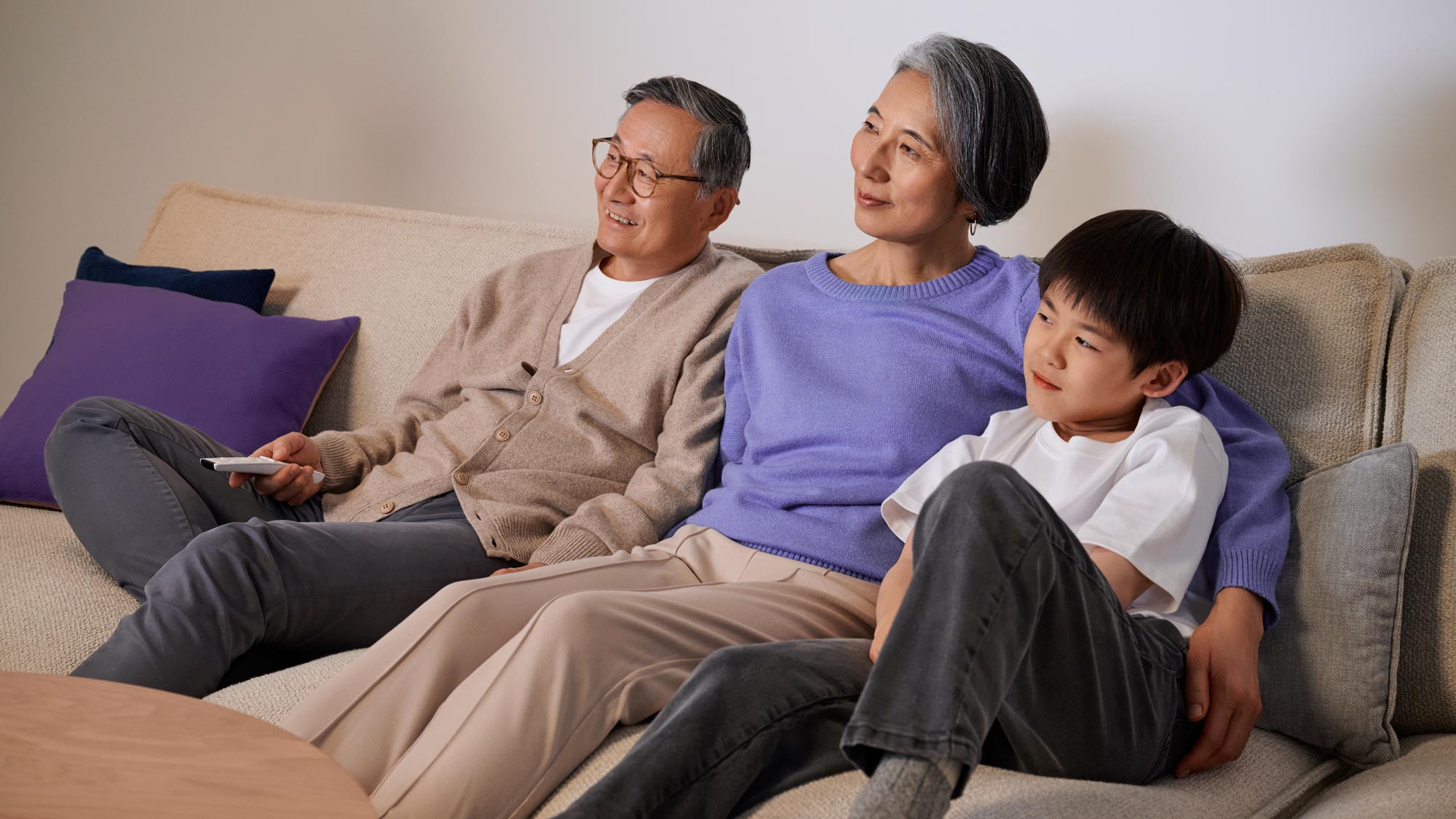 Family watching tv in a hearing-friendly living room