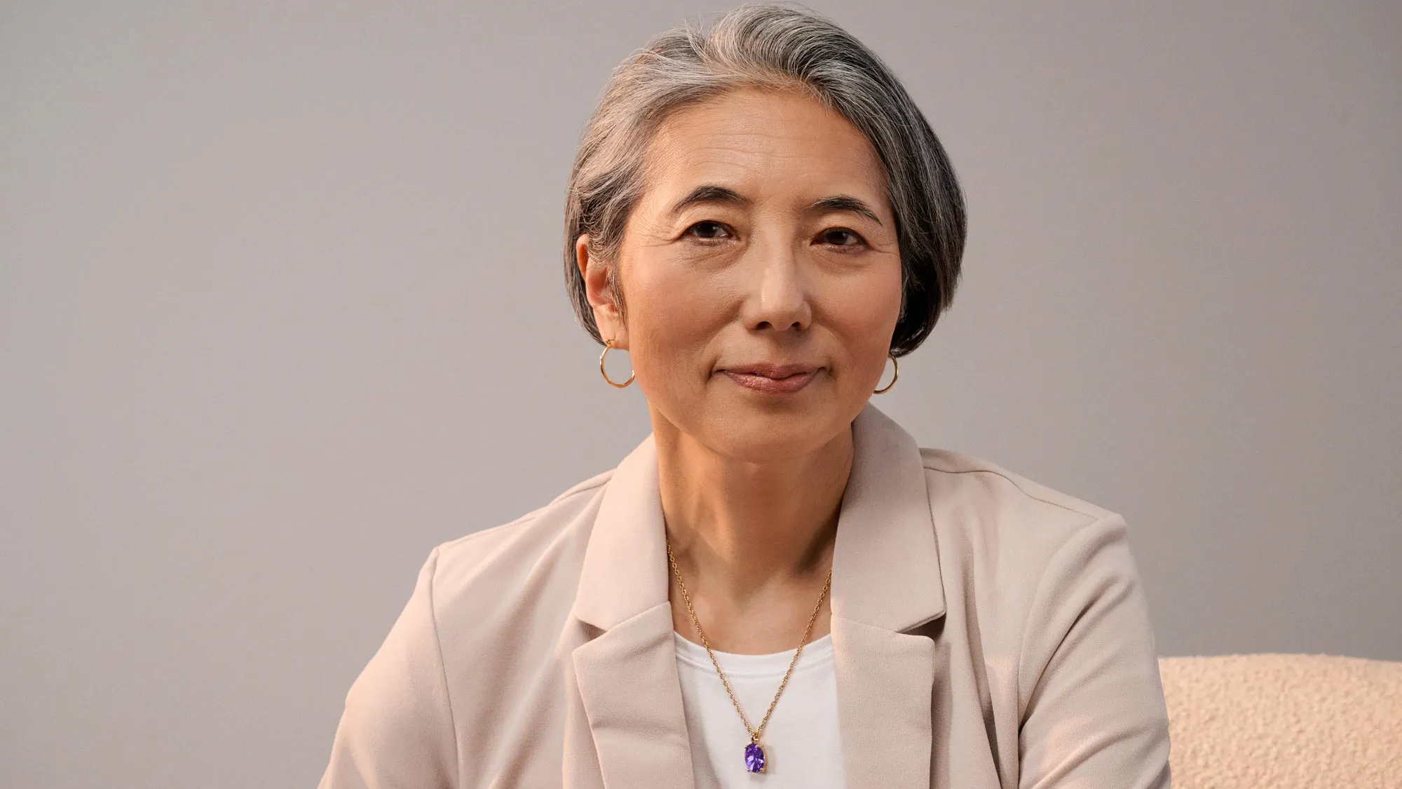 Portrait of a trusting woman, showcasing hearing aids.