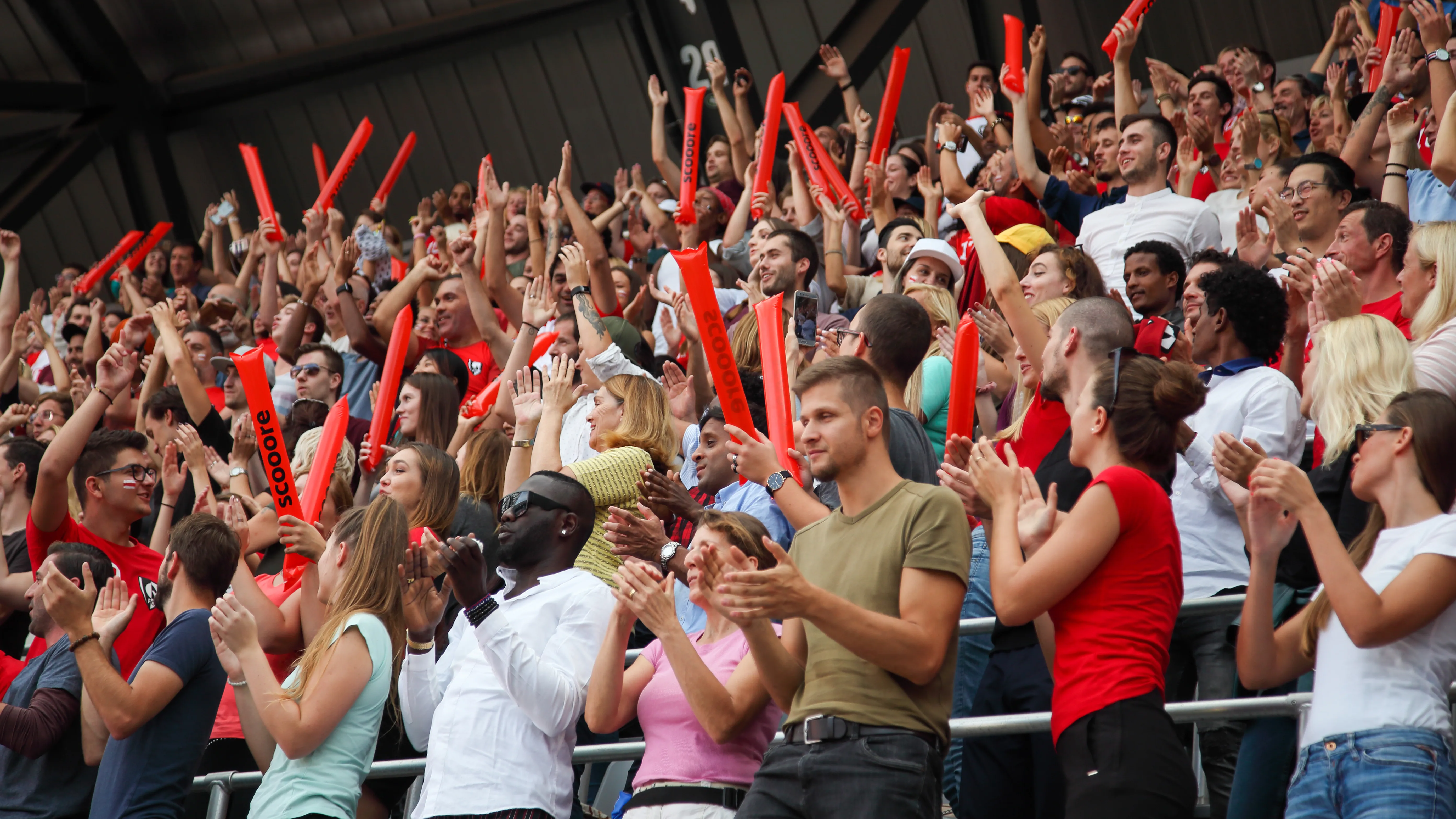 Crowd cheering during an event using hearing aids