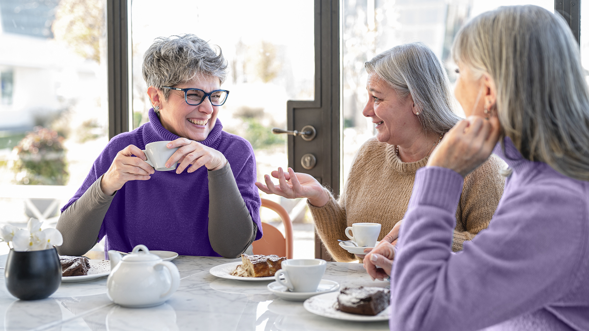 Stay socially connected and enjoy memorable conversations with friends at your favorite cafe, thanks to hearing aids.
