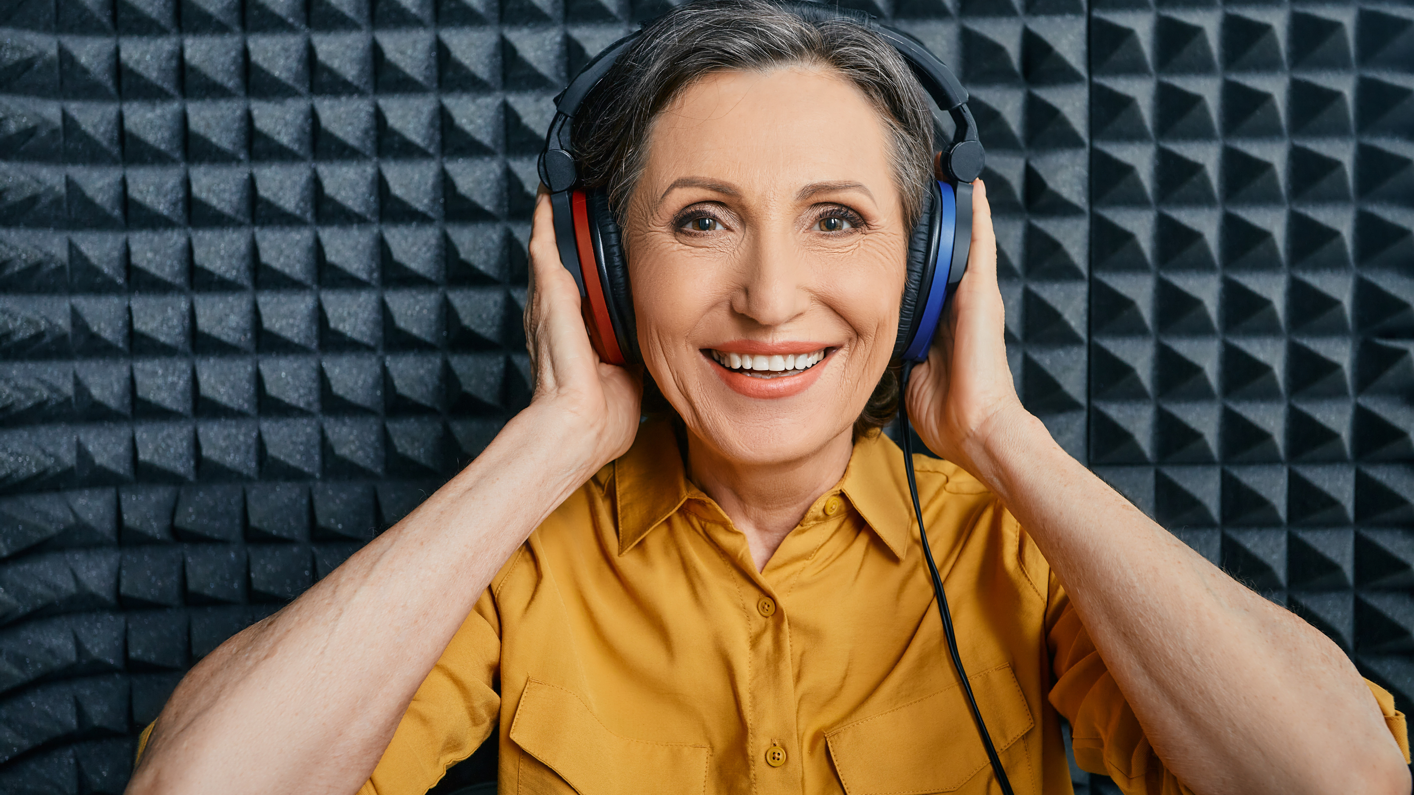 Woman testing her ears for hearing loss