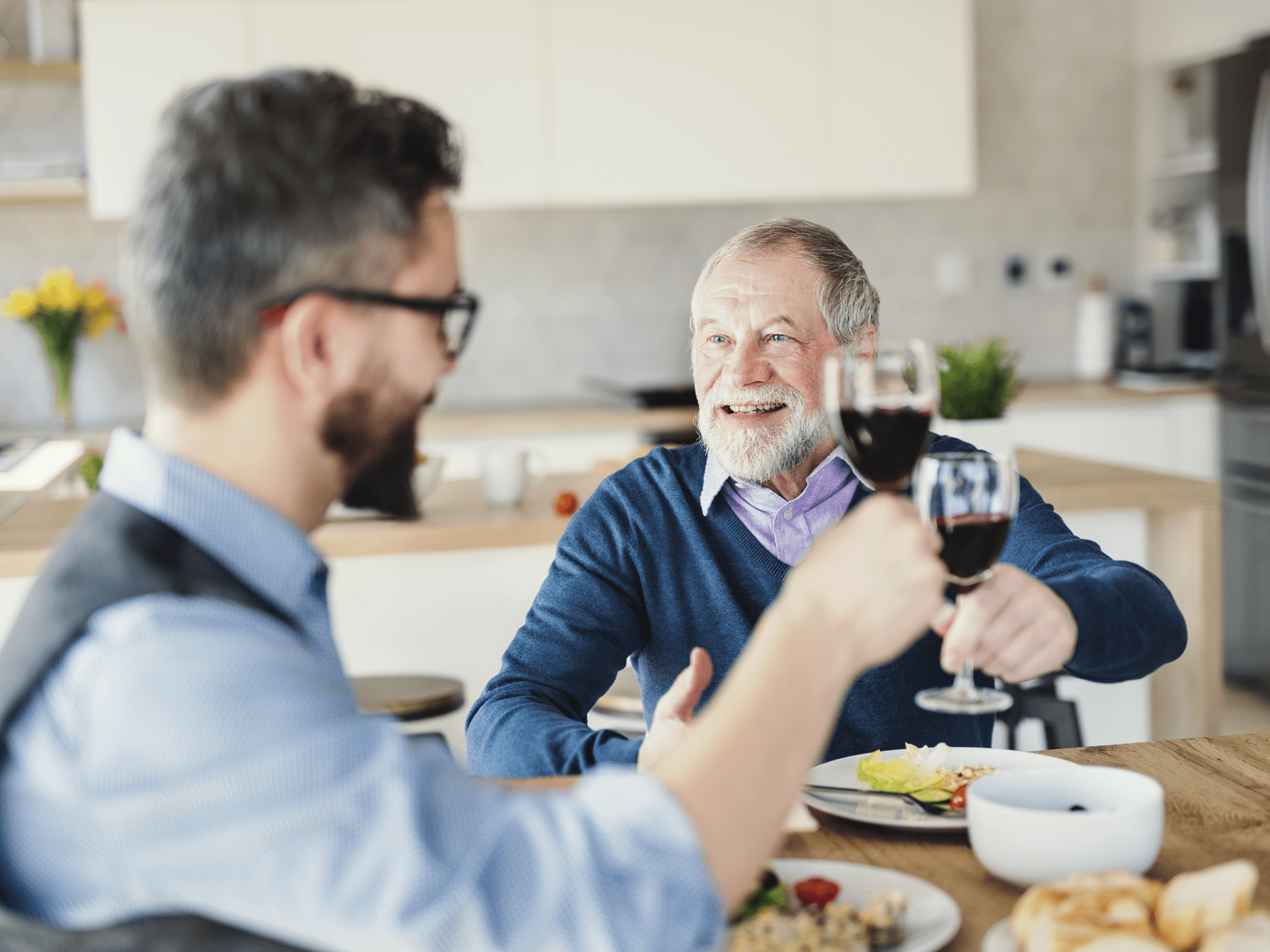 Father and son having a good time while wearing hearing aids