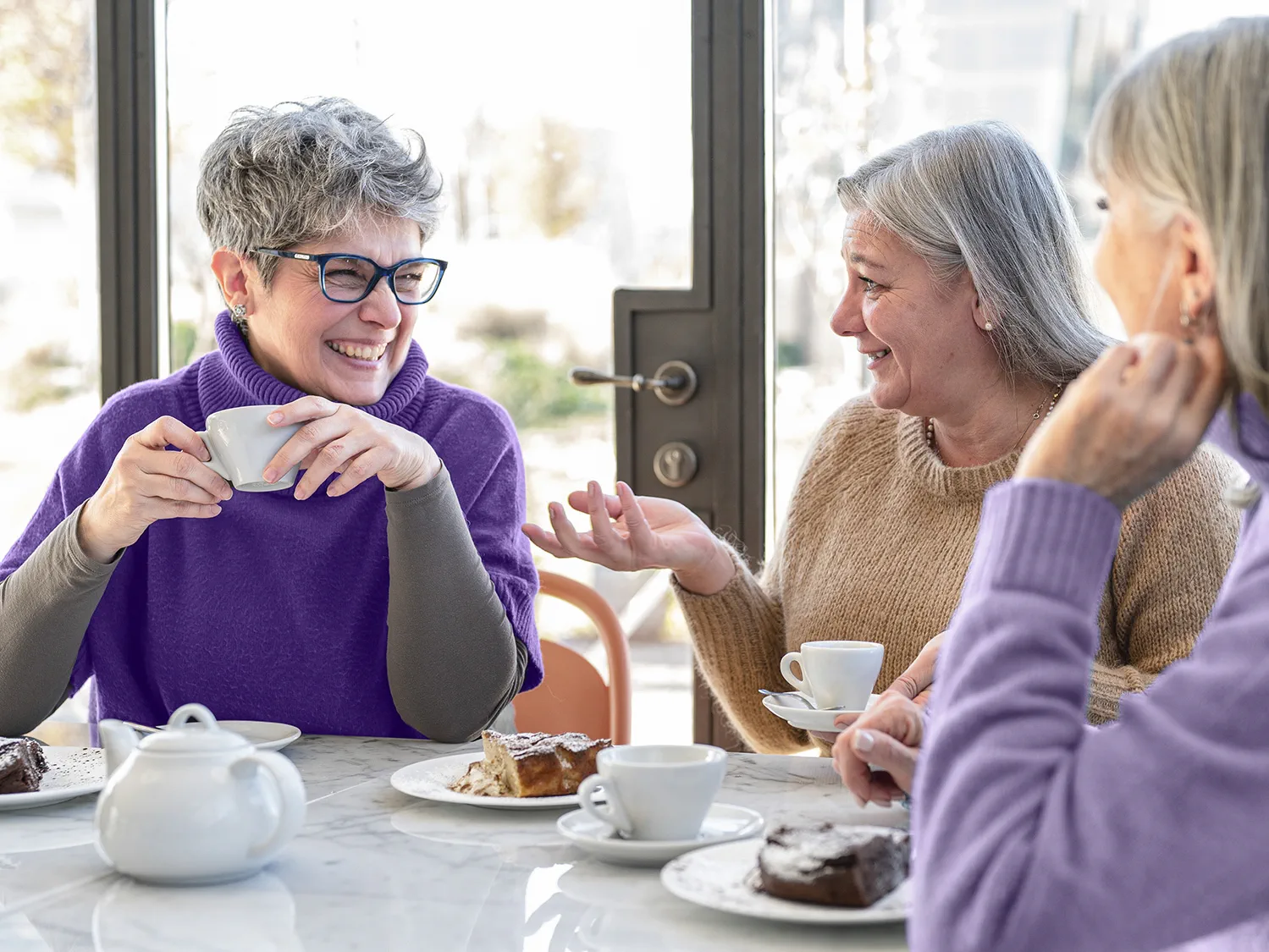 Stay socially connected and enjoy memorable conversations with friends at your favorite cafe, thanks to hearing aids.