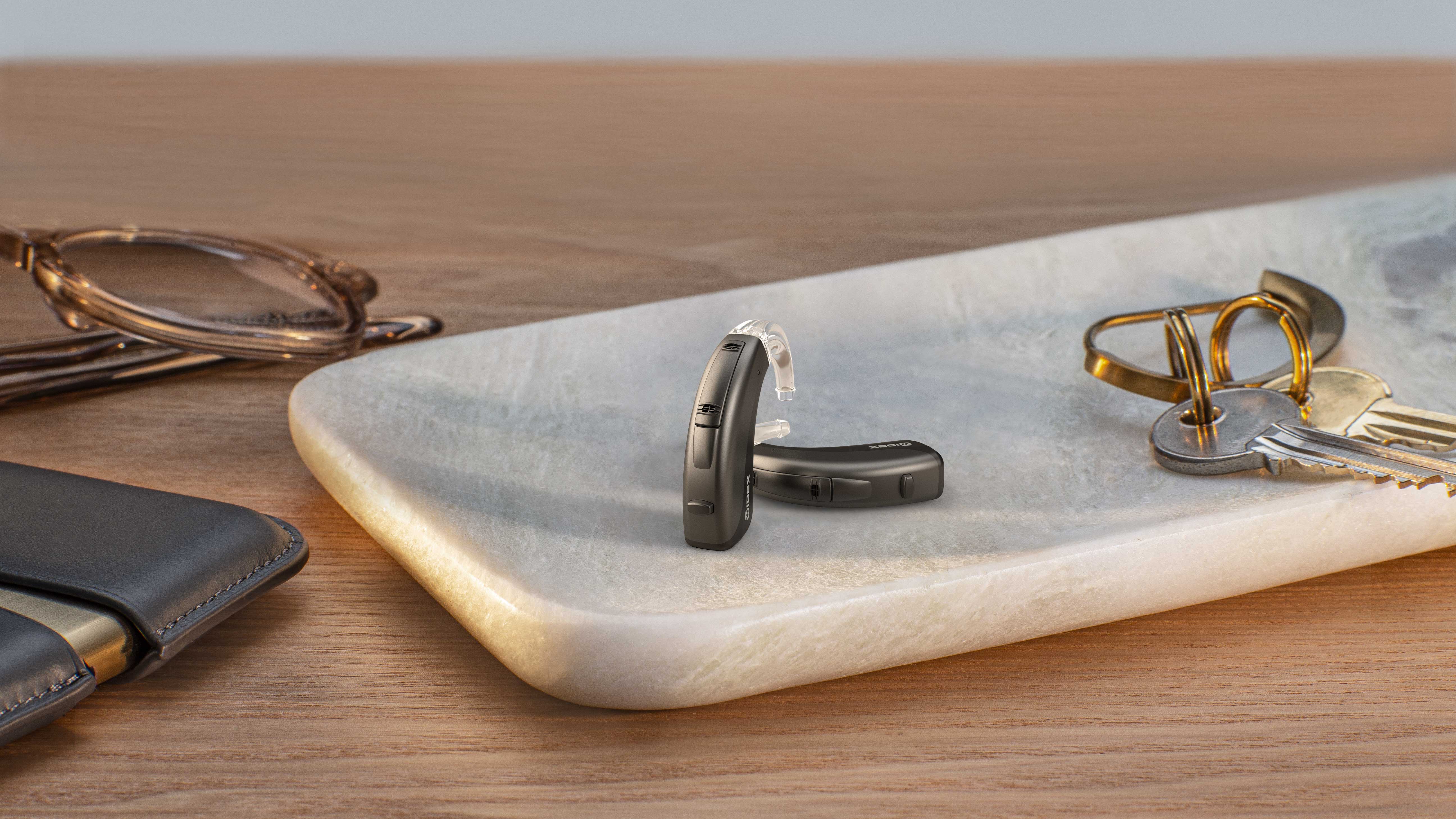 Widex behind the ear 312 represented in a home environment to show the true size of the hearing aid. 