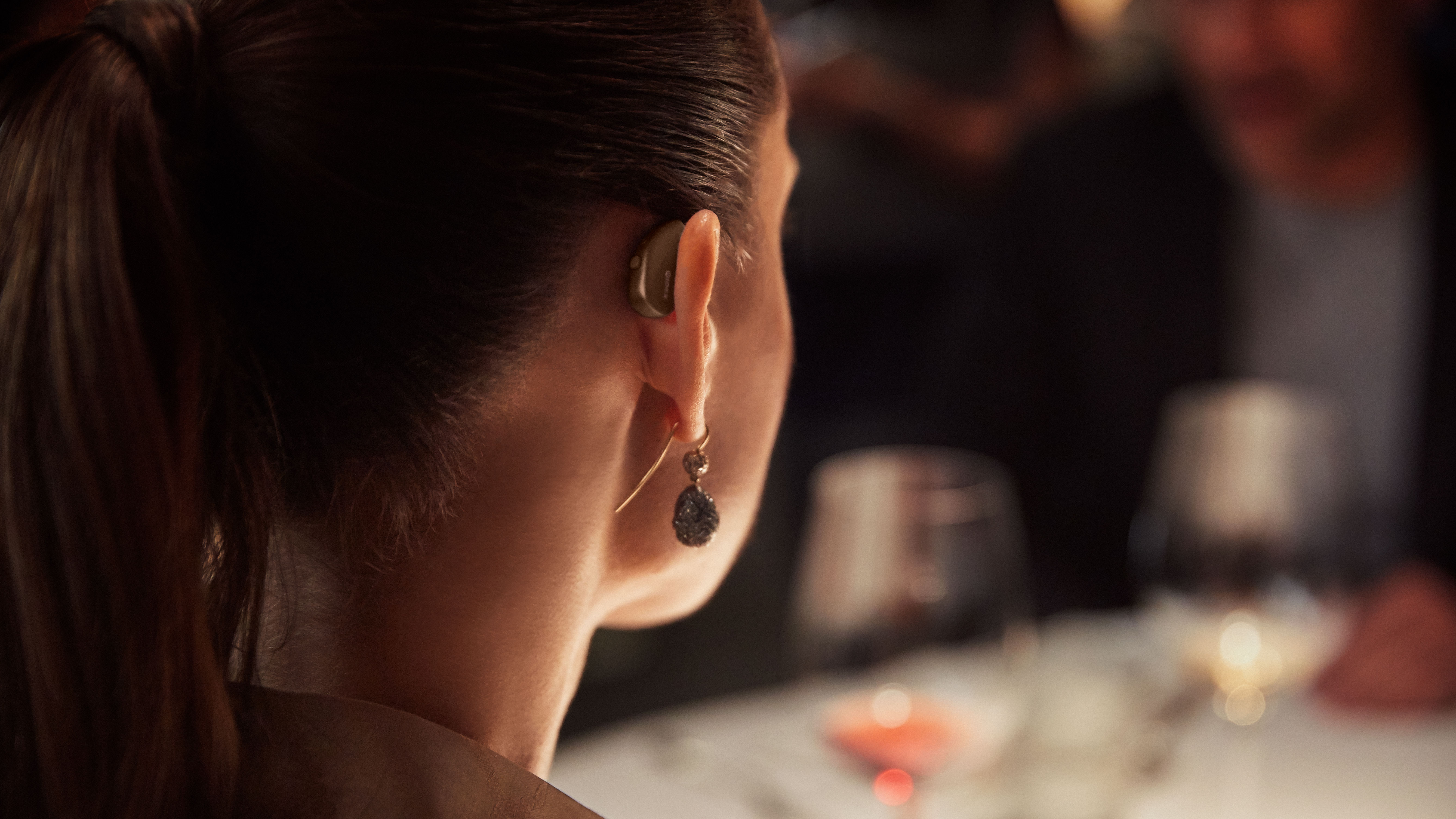 Immerse in restaurant ambiance, soft lighting, soothing music, and relaxed conversations with hearing devices.