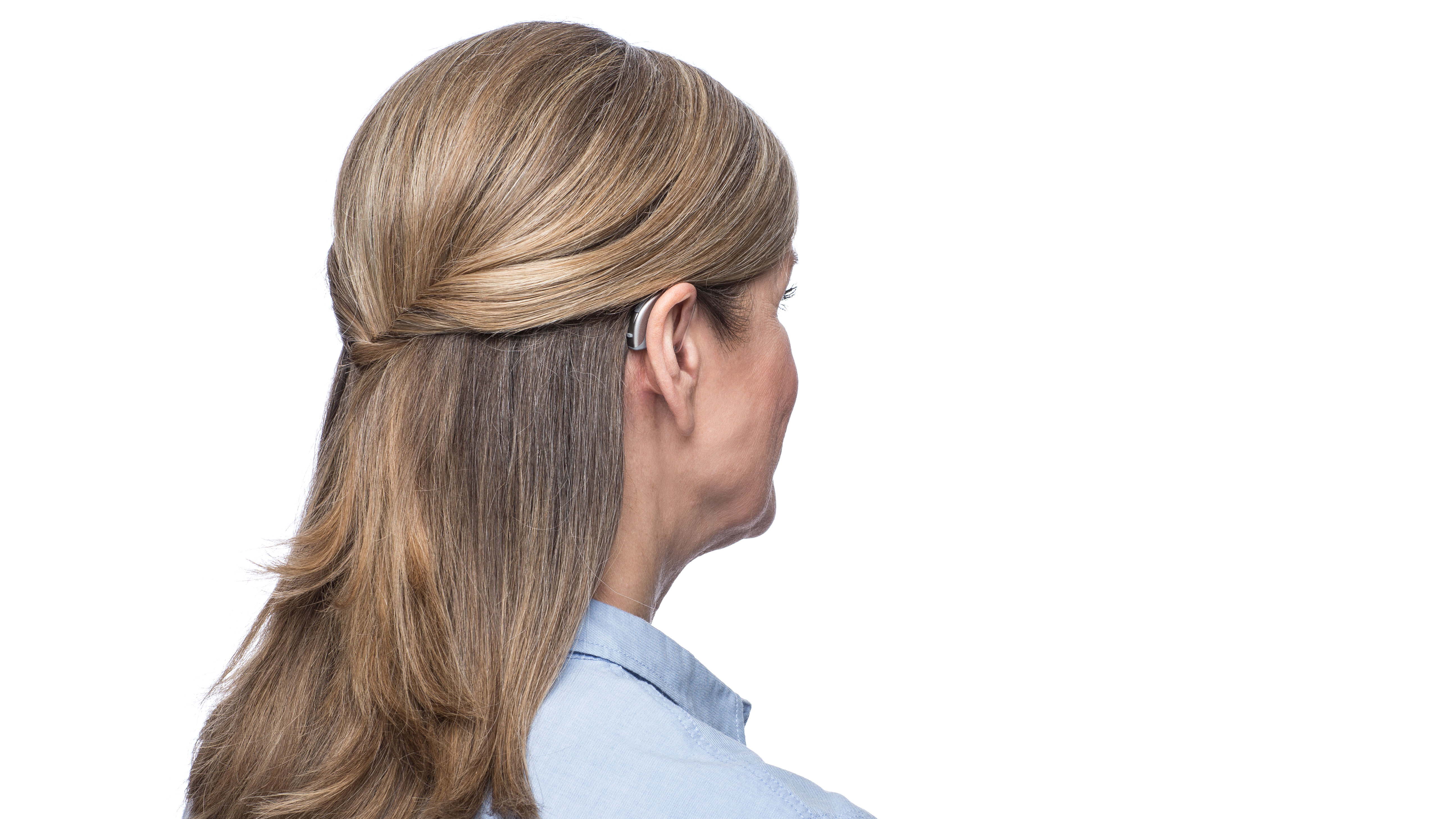 Widex Moment 312 BTE on woman - Unique Fashion Mini. 