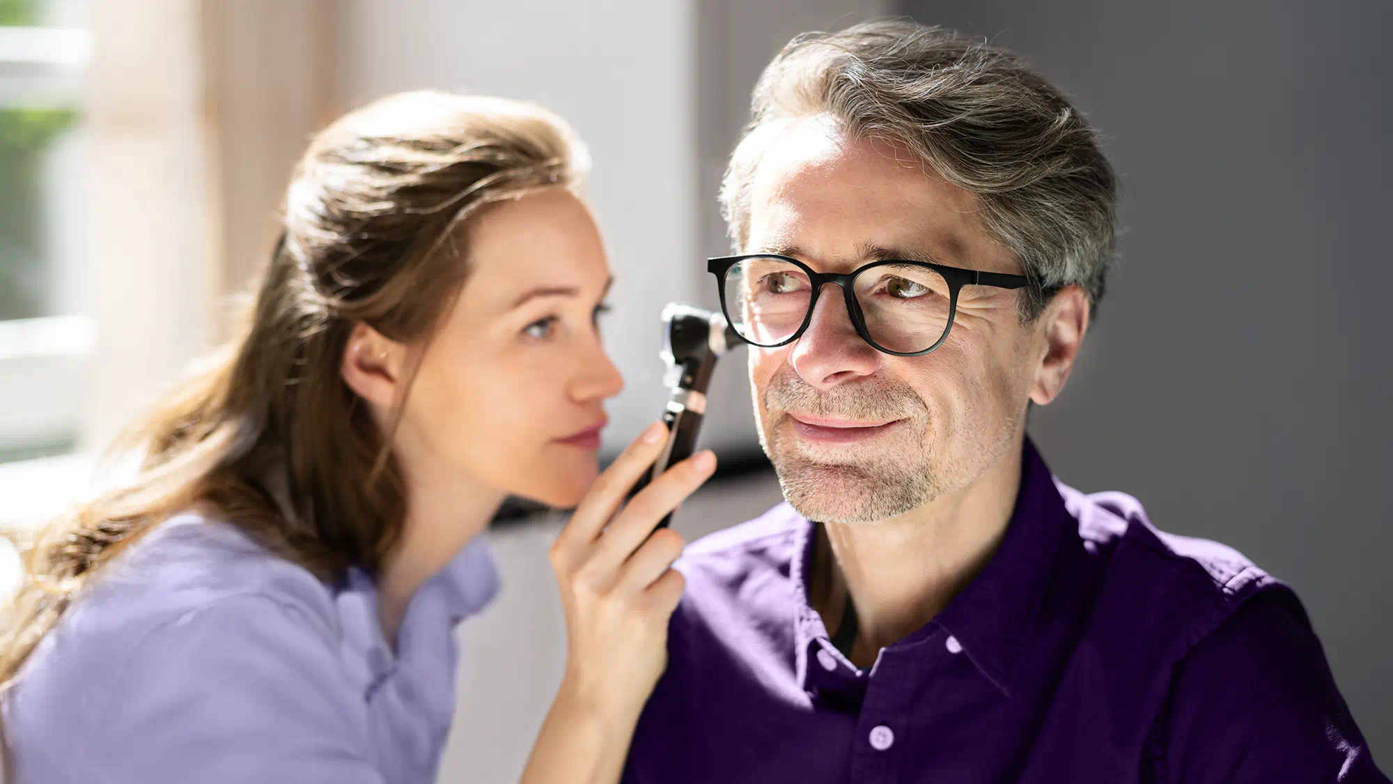 audiologist checking up the ear hearing loss