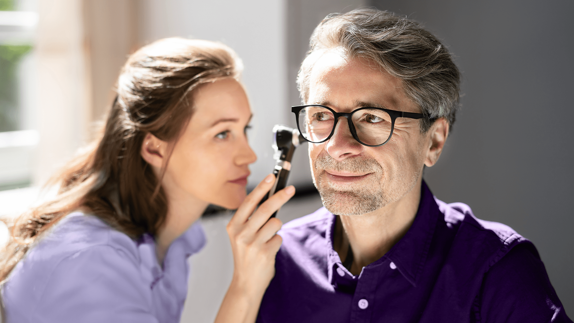 audiologist checking up the ear hearing loss