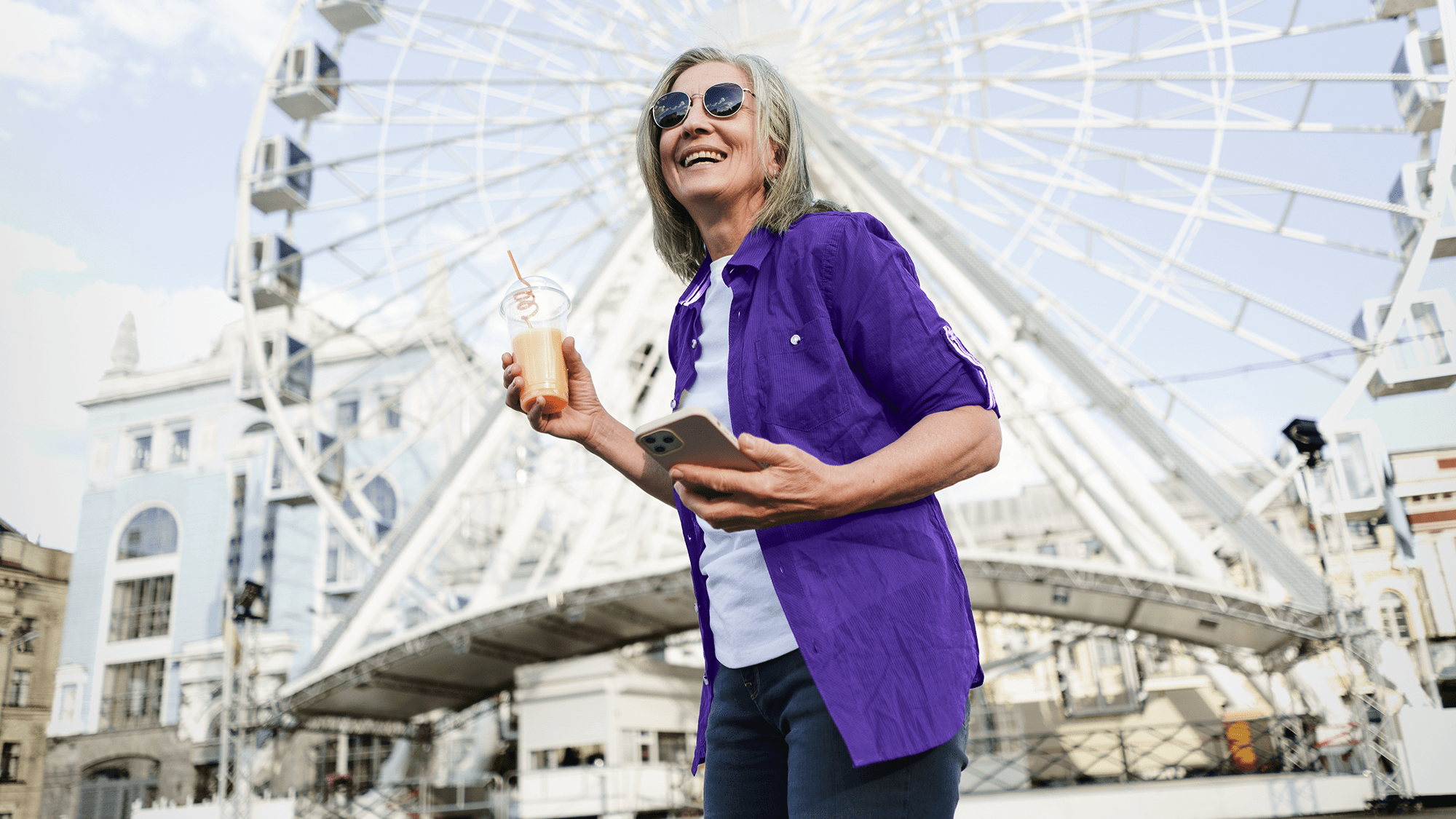Women next to ferris wheel. 
