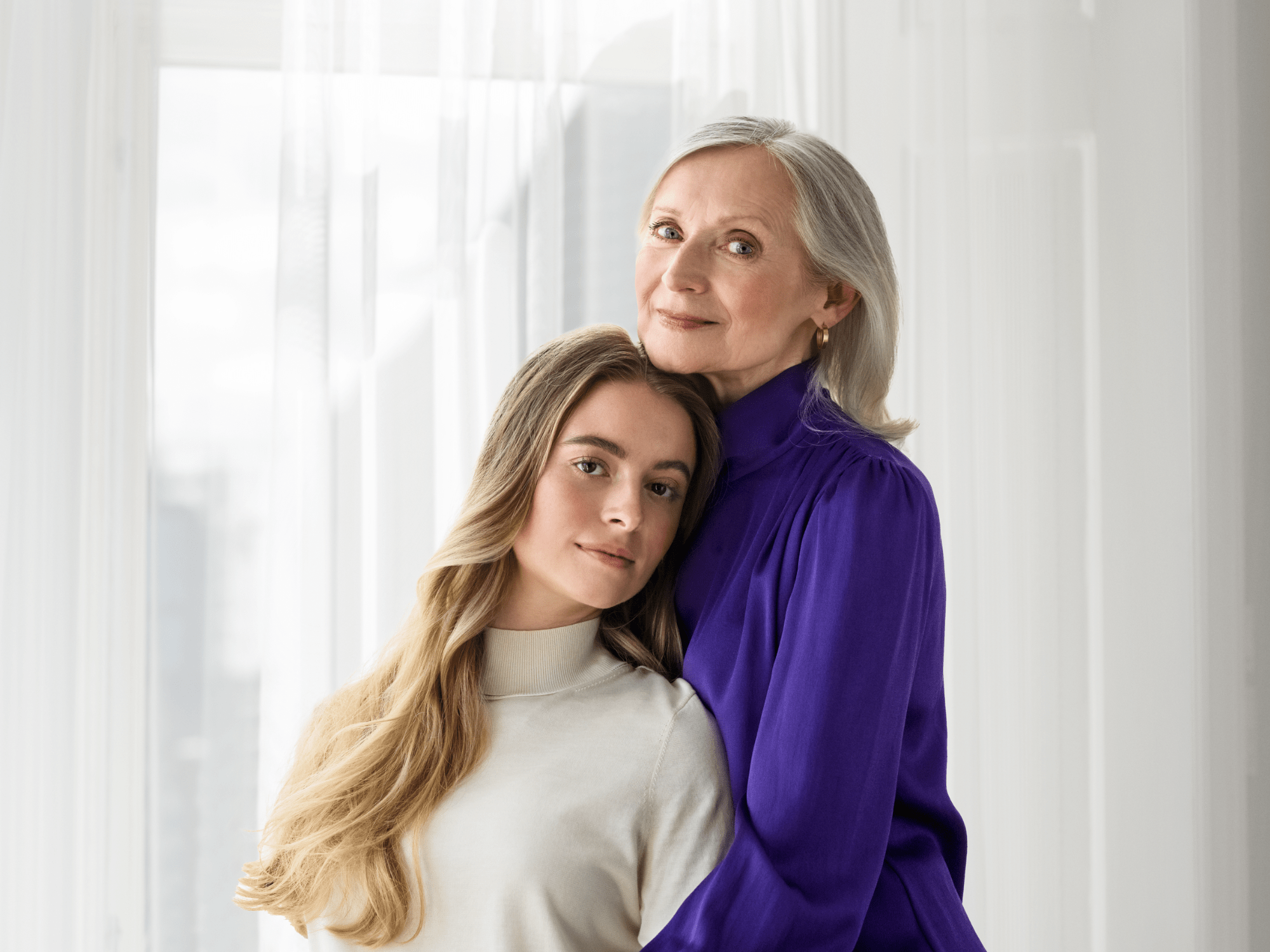 The daughter is cuddling on her mother's shoulder and enjoying the sound.