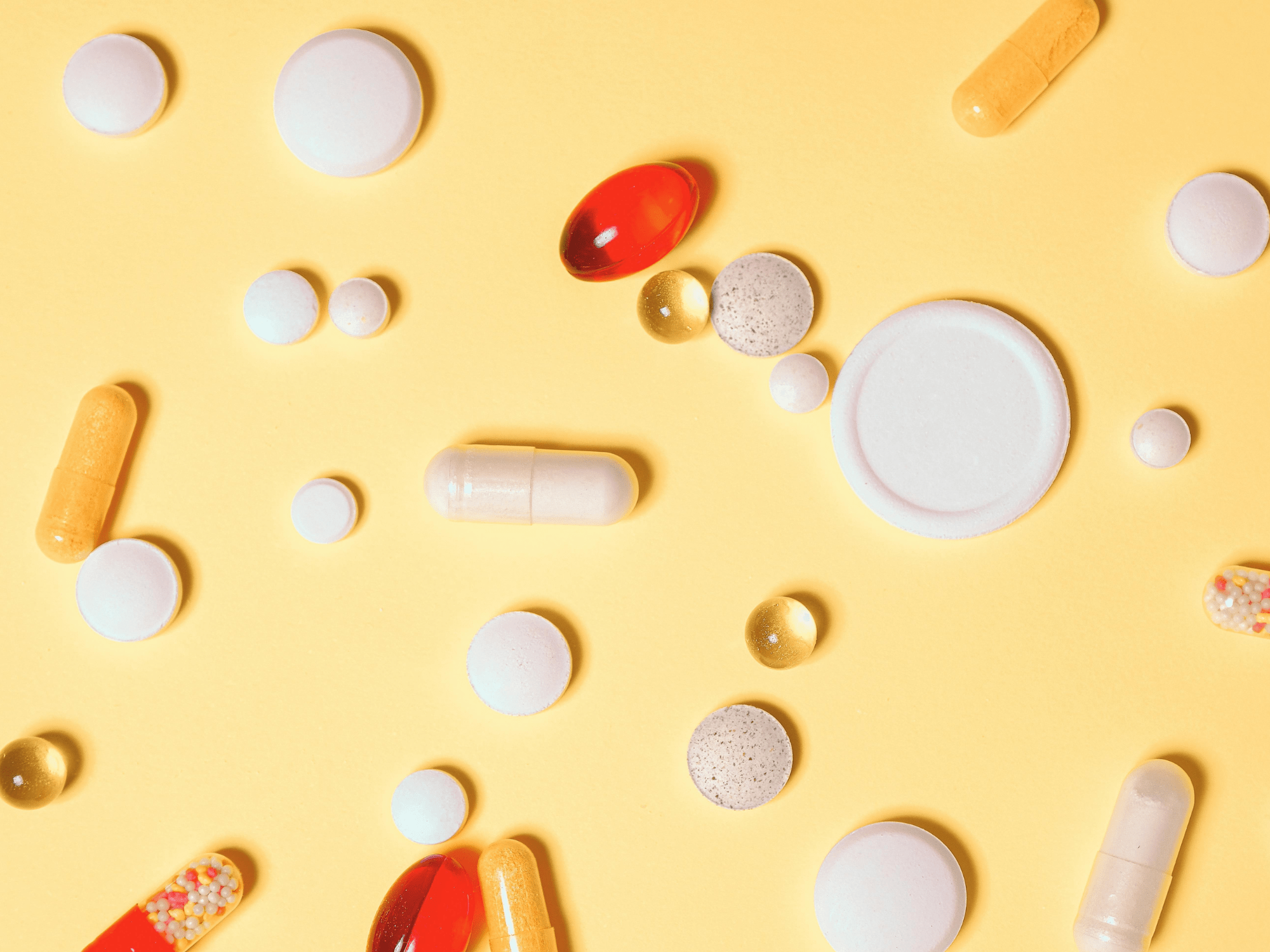 An orange table with hearing loss tablets for aids.