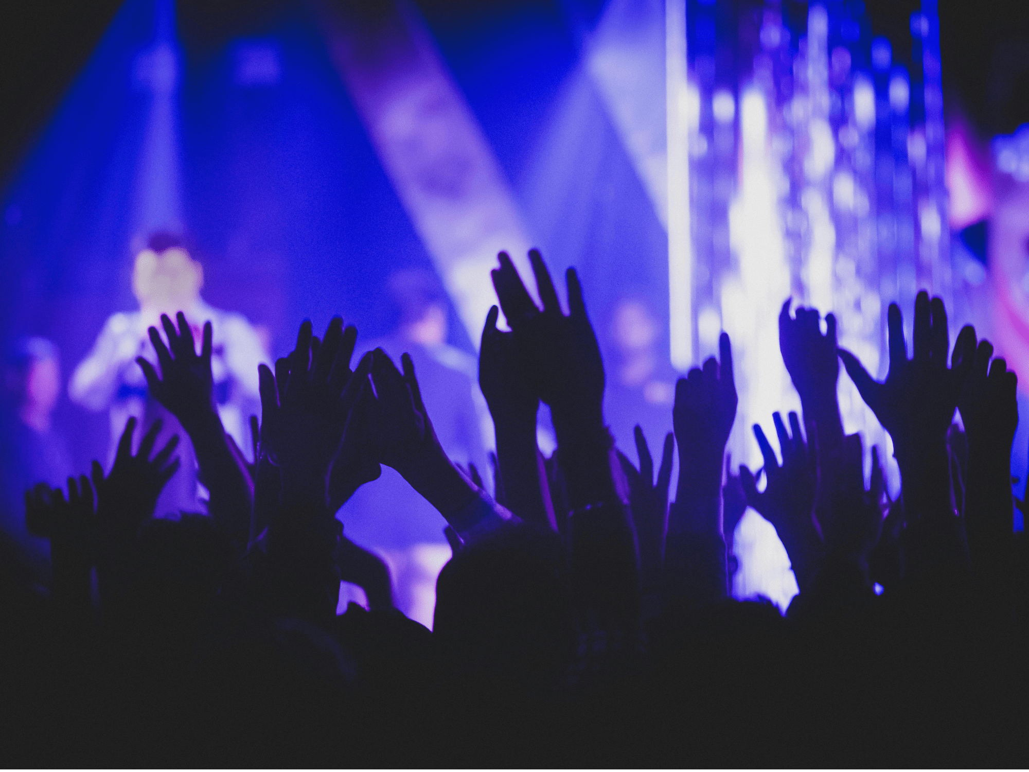 People are gathering in the club and enjoying hearing the music.