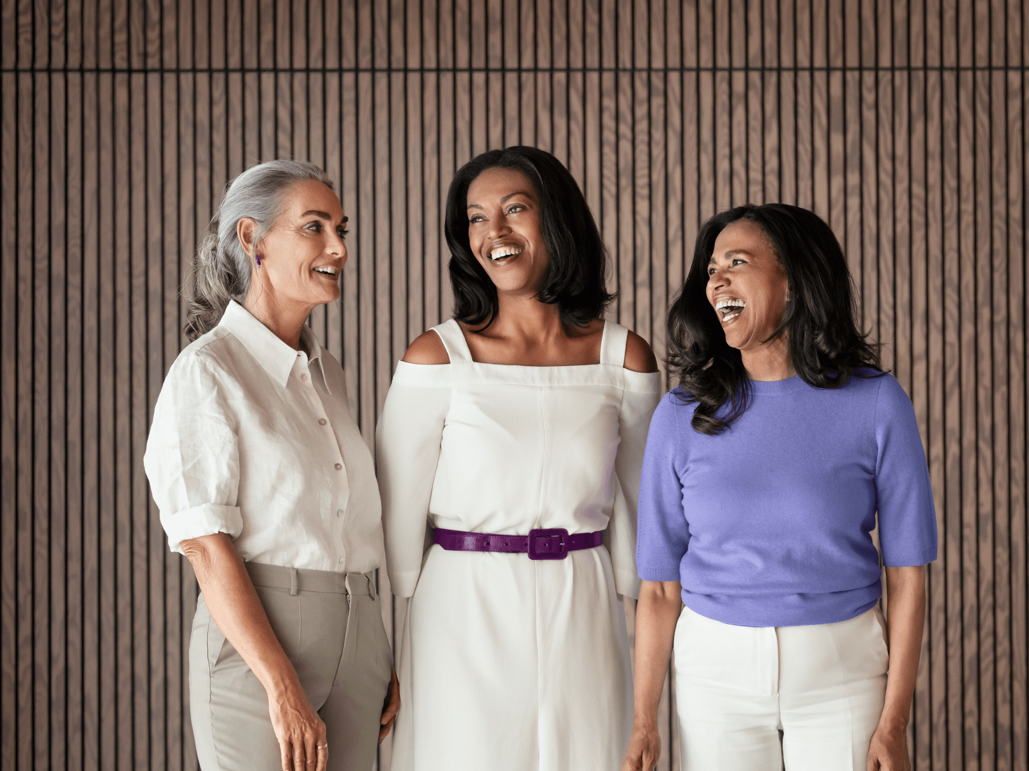 Three women are satisfied with their hearing aids.