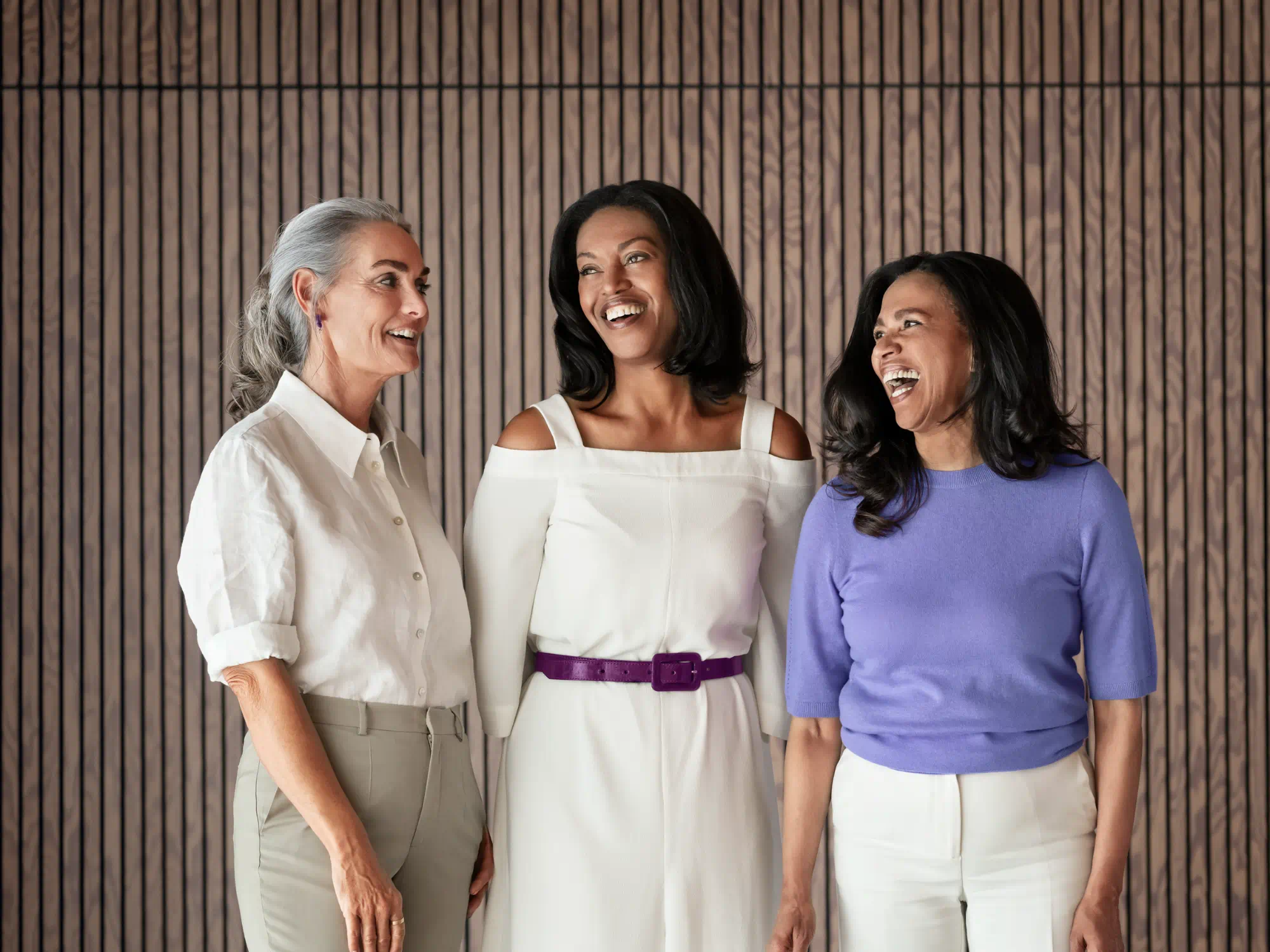 Three women are satisfied with their hearing aids.