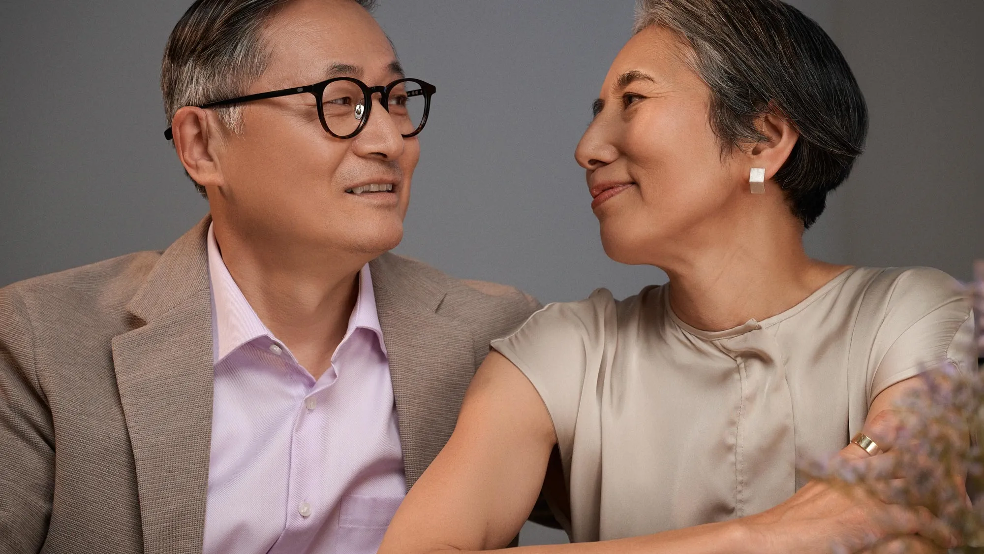 couple having dinner, wearing hearing aids