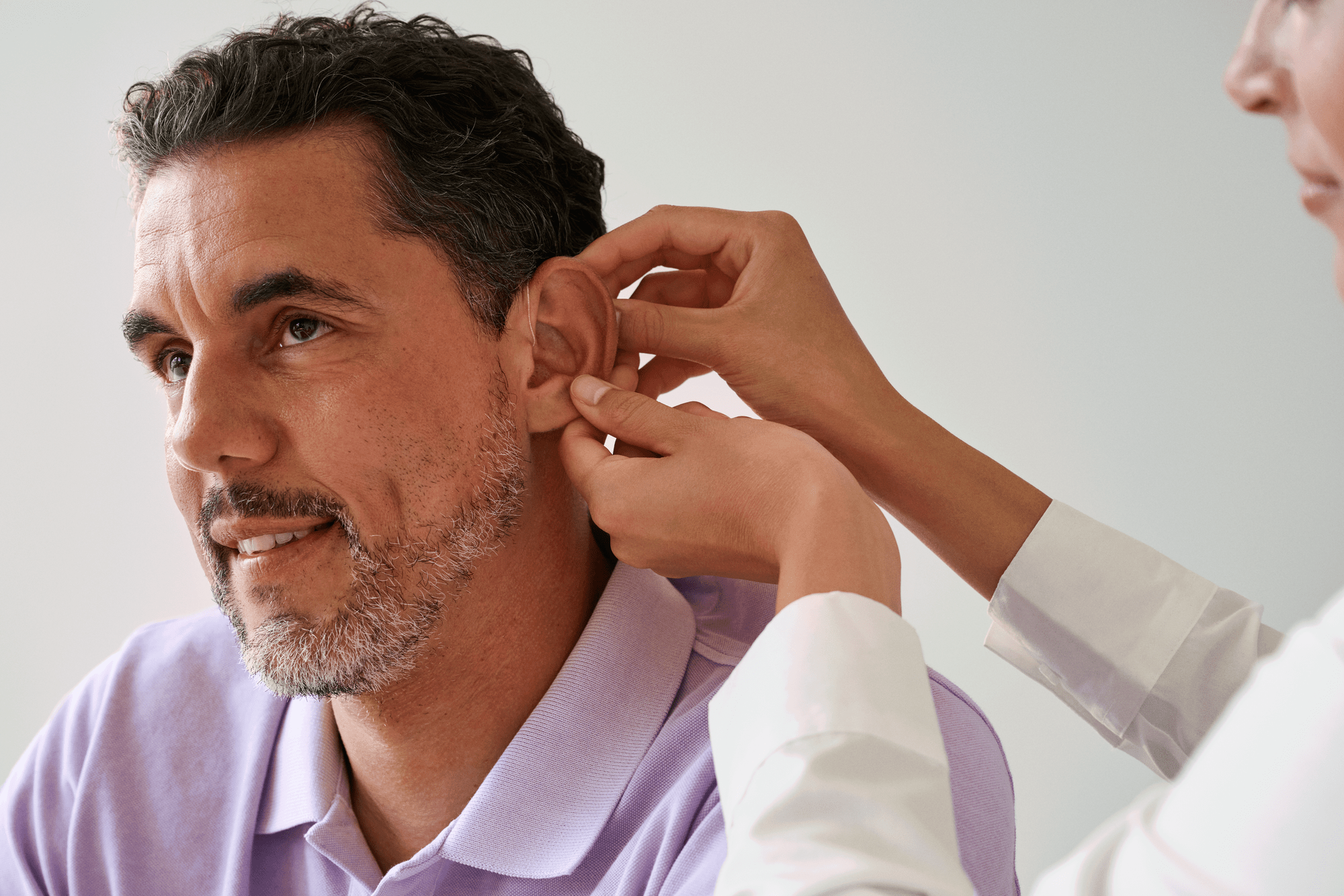 fitting hearing aids in ear