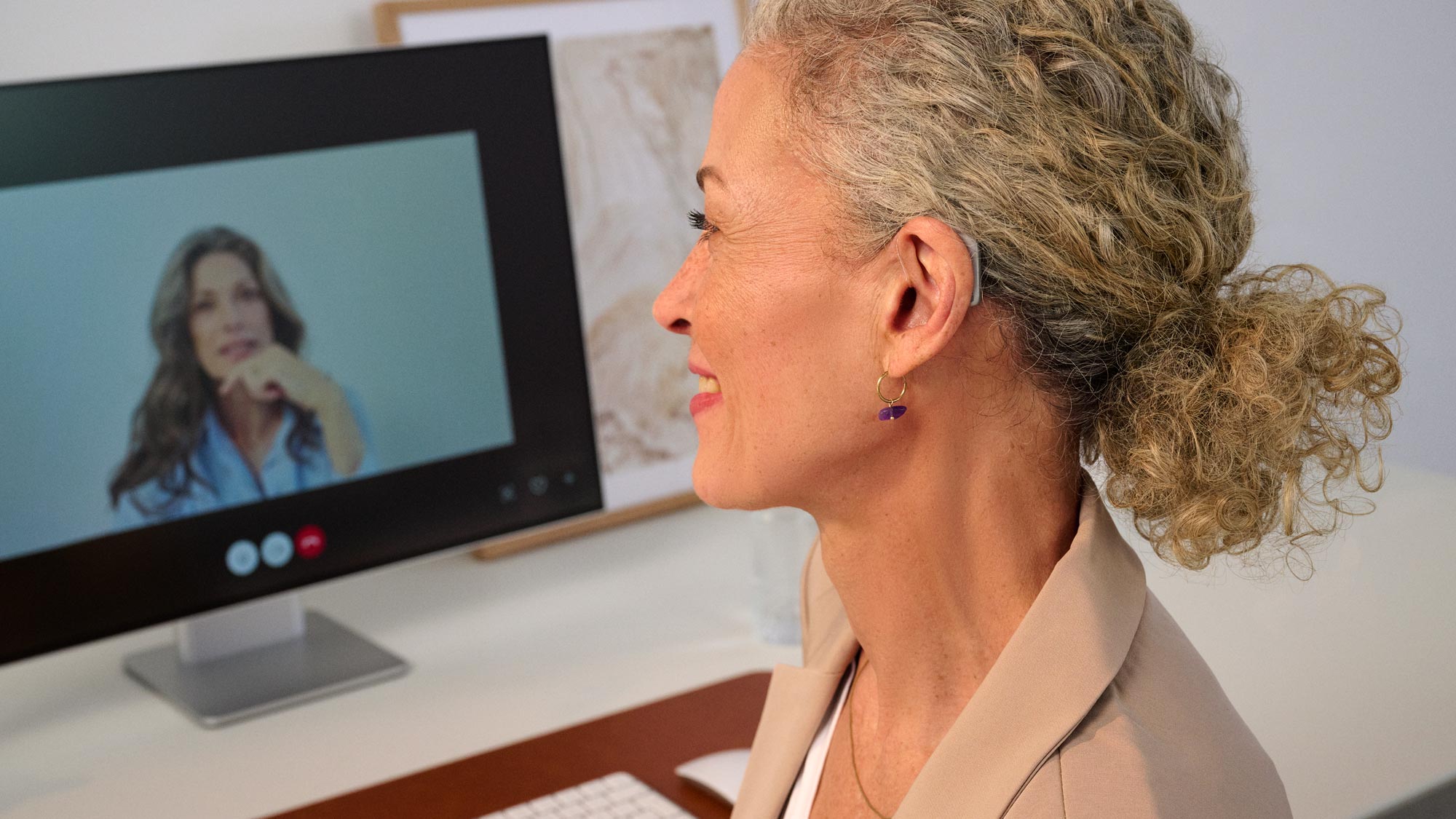woman on a meeting with hearing aids