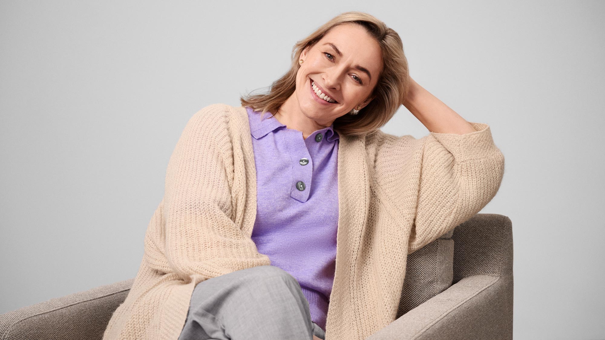 woman smiling, wearing hearing aids