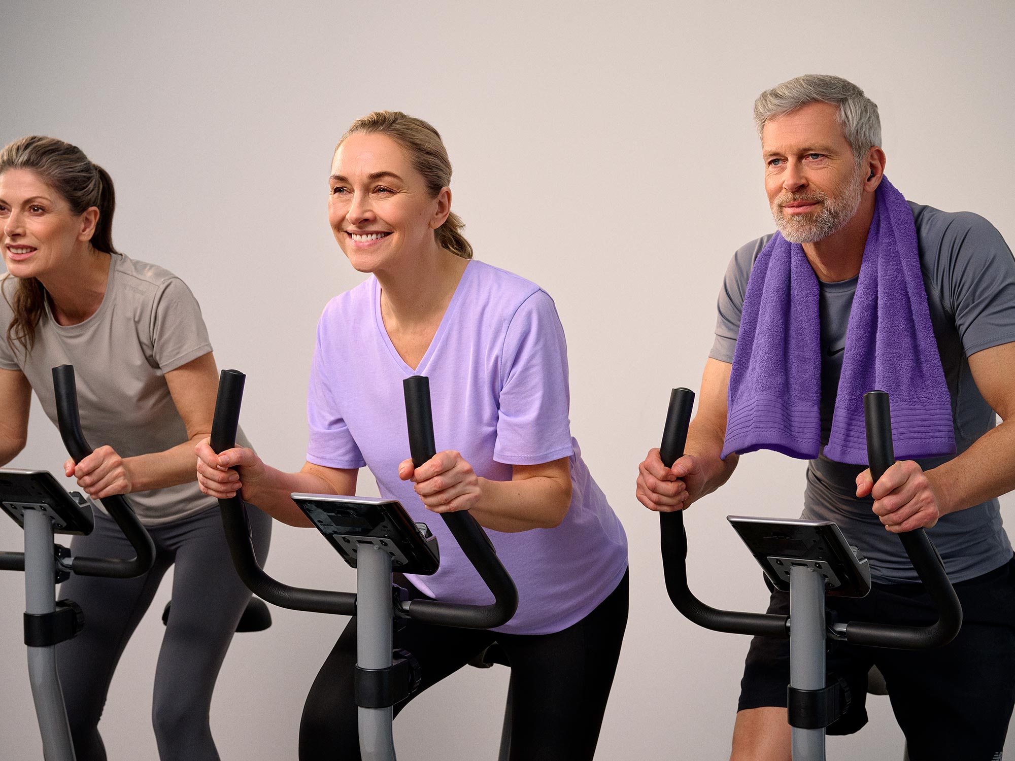 Friends working out together wearing hearing aids