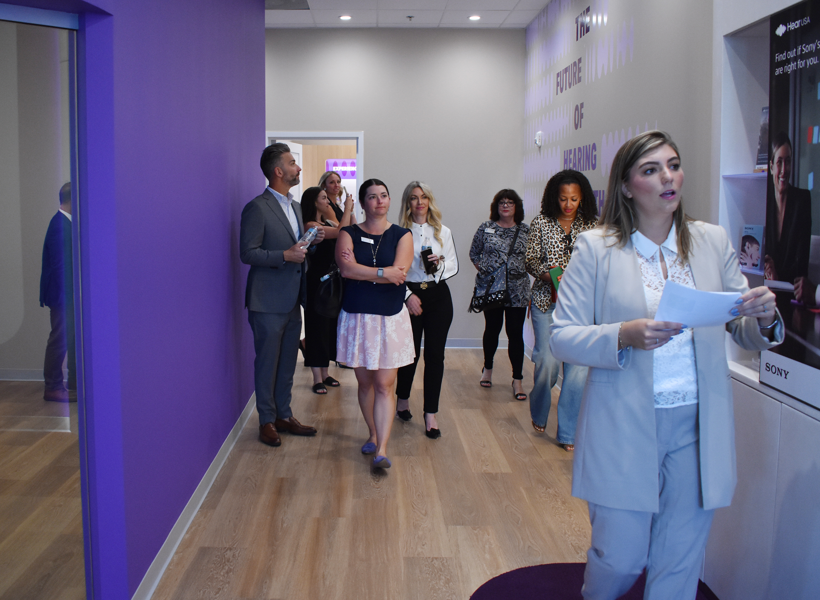 katelyn giving a tour at a HearUSA hearing center