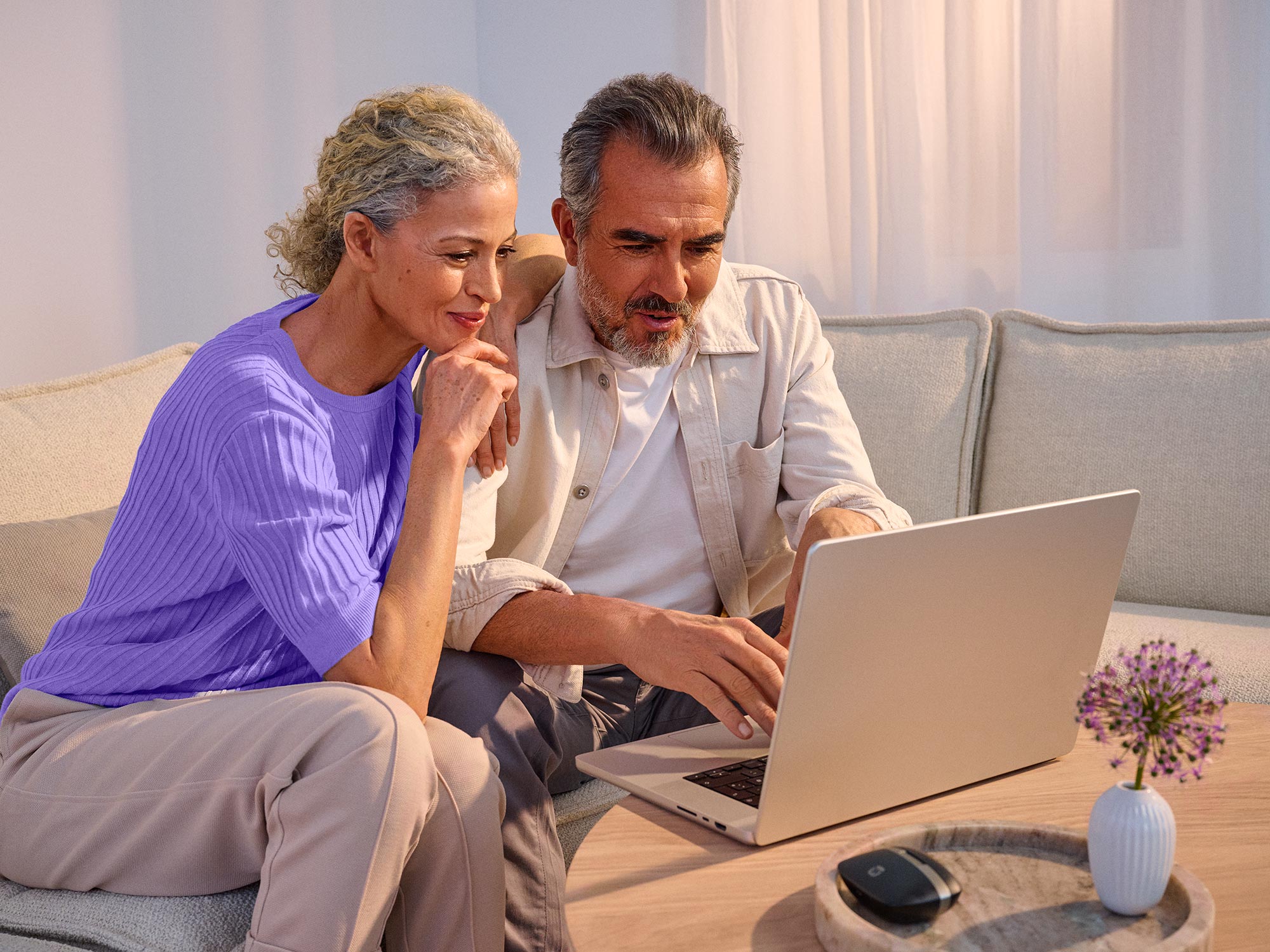 couple taking online hearing test hearing aids