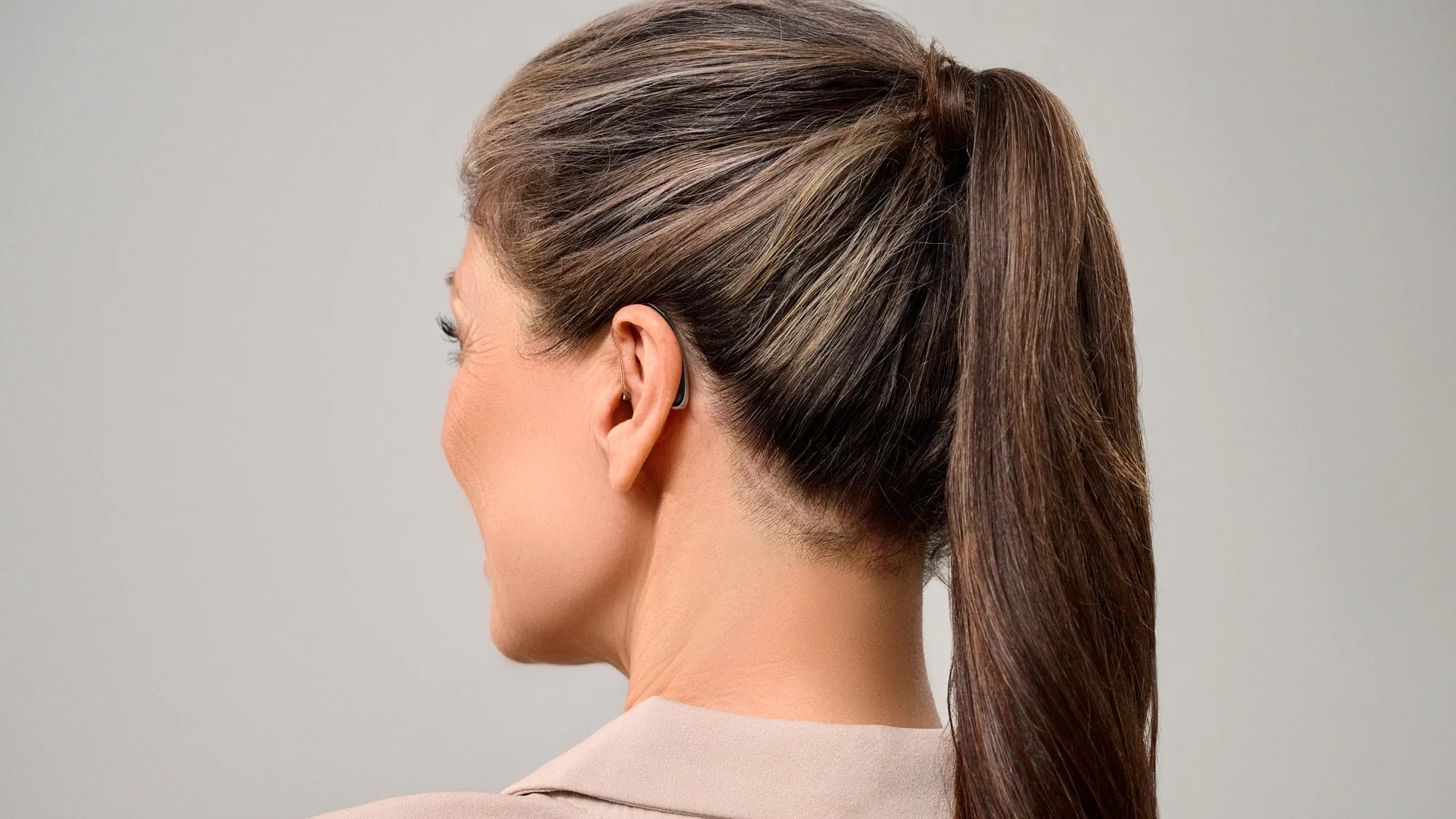 woman wearing discreet hearing aids