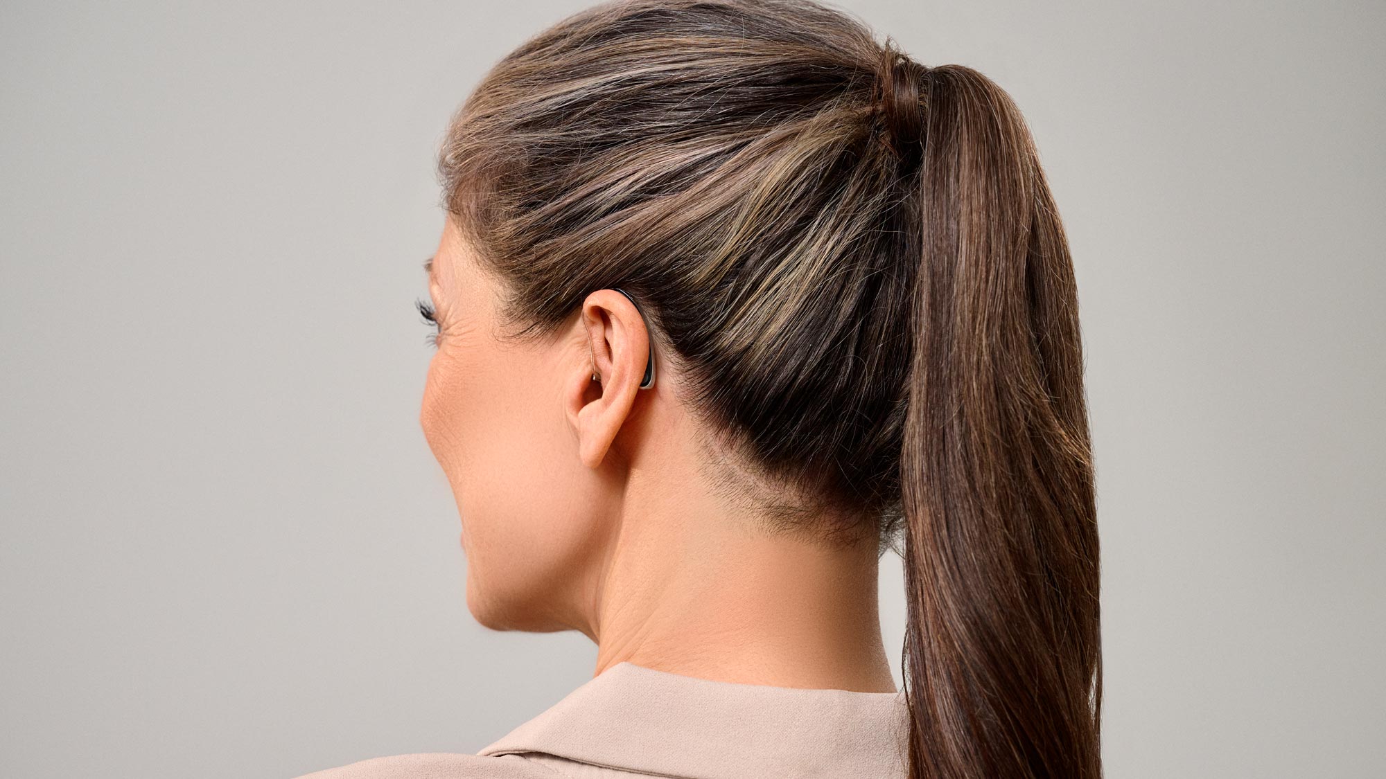 woman wearing discreet hearing aids