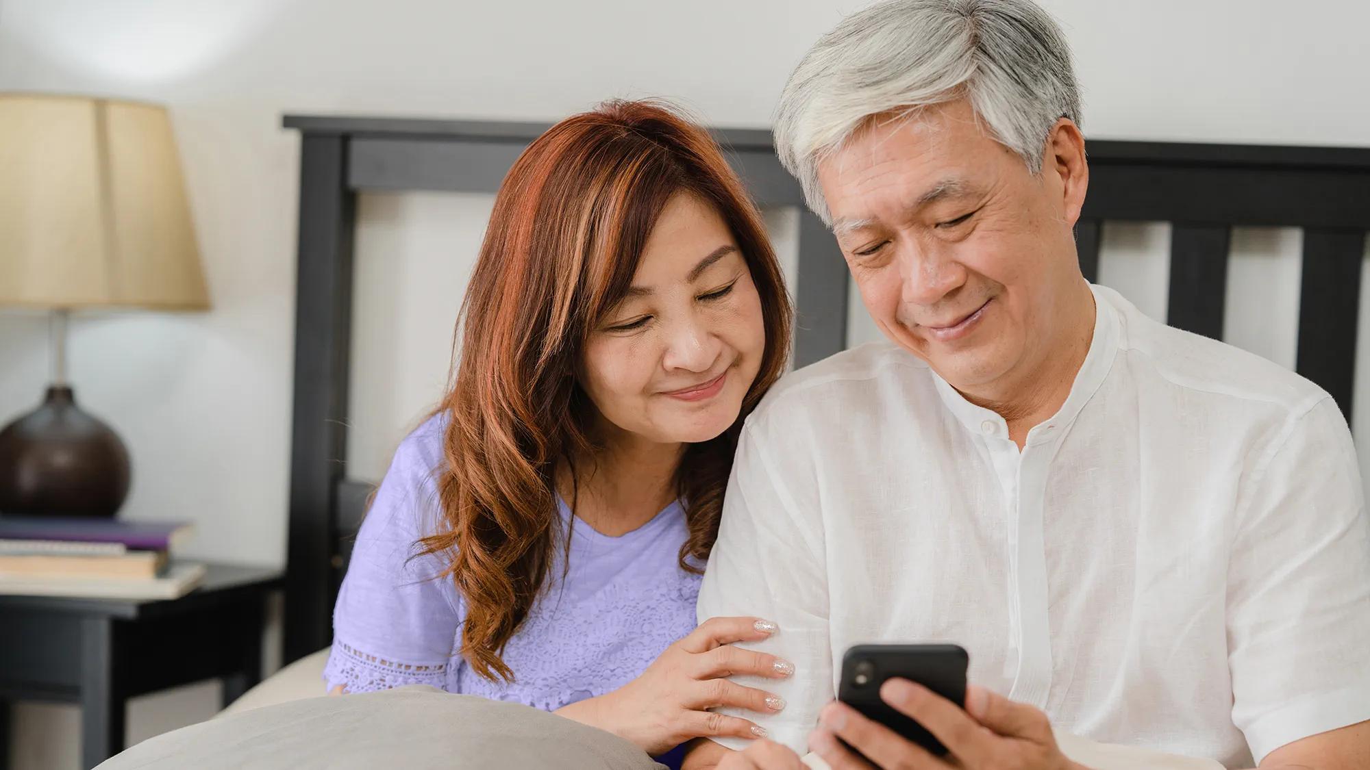 Couple having a nice and casual time at home thanks to hearing aids